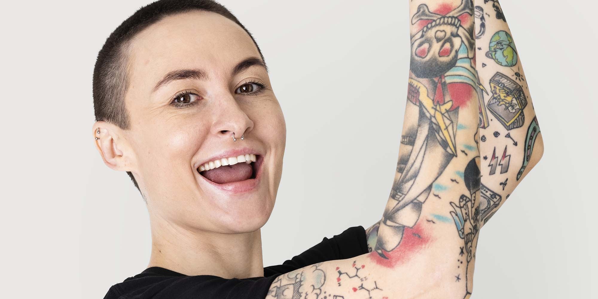 Tattooed happy model in black t shirt mockup